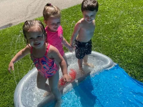 a group of children in a pool