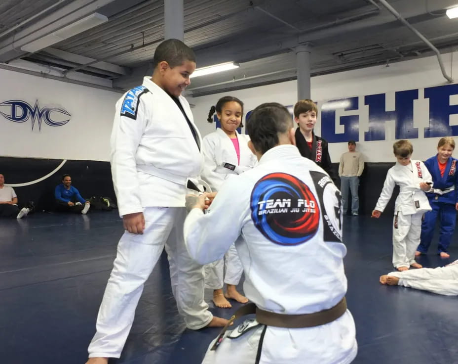 a man and a boy in karate uniforms