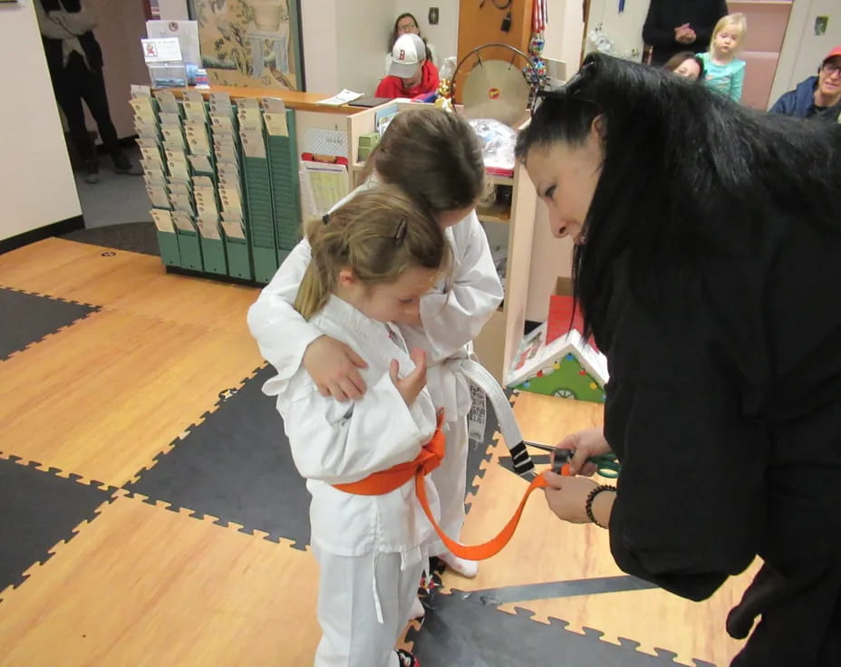 a person holding a child