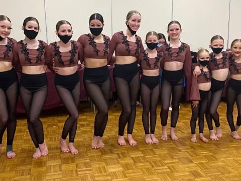 a group of women in a dance pose