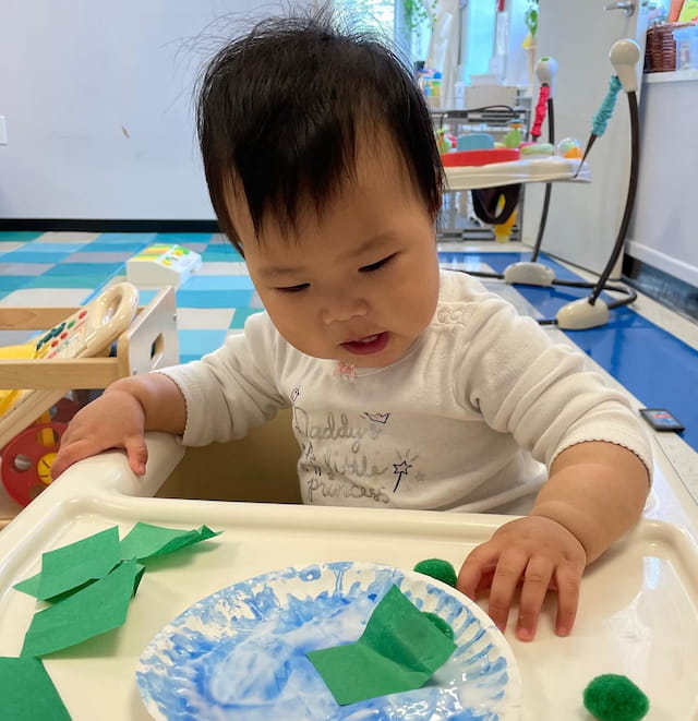 a child painting on a table