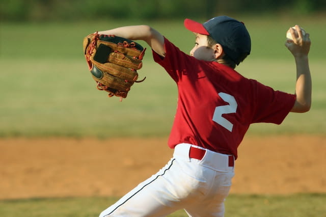 a baseball player throwing a ball