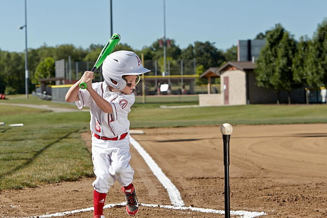 a young boy playing baseball