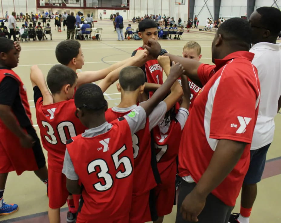 a group of boys in red uniforms