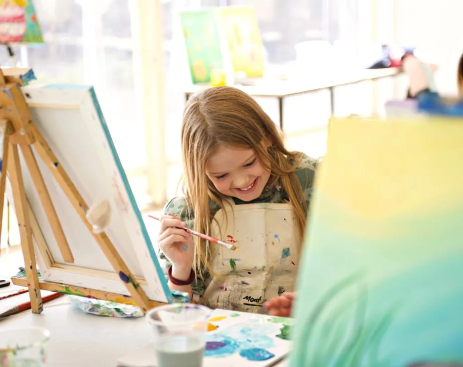 a young girl painting