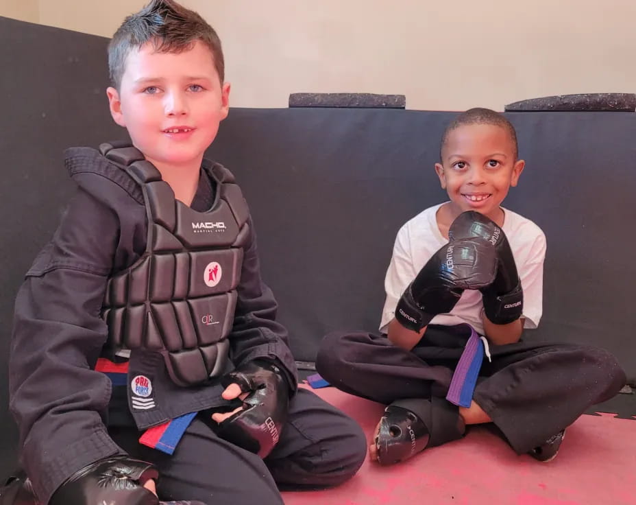 two boys sitting on a couch