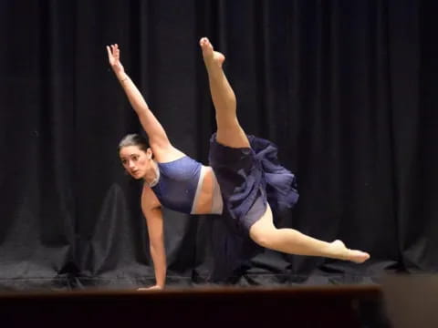 a woman dancing on a stage