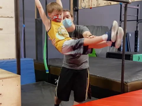 a woman lifting another woman up