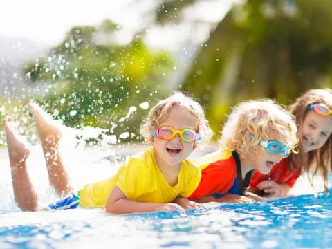 a group of children in a pool