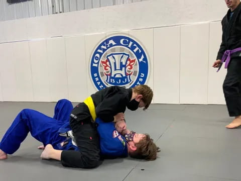 a person holding another man