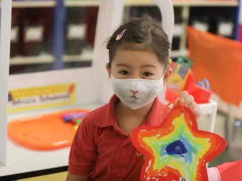 a girl with a face mask