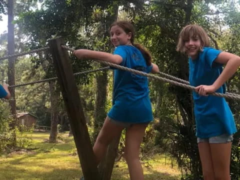 a group of girls in blue shirts