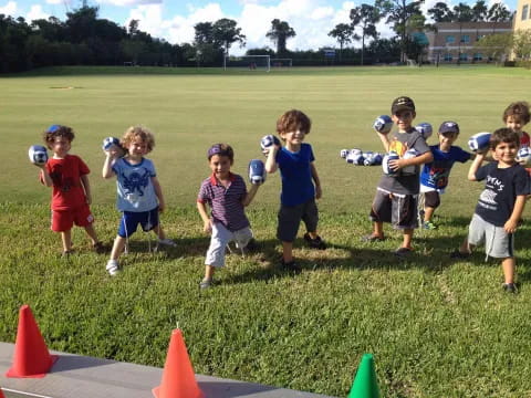 a group of kids playing with balls