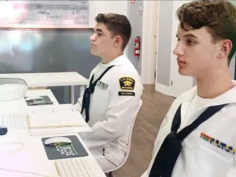 a couple of men in white uniforms