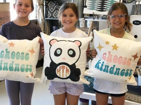 a group of girls holding signs