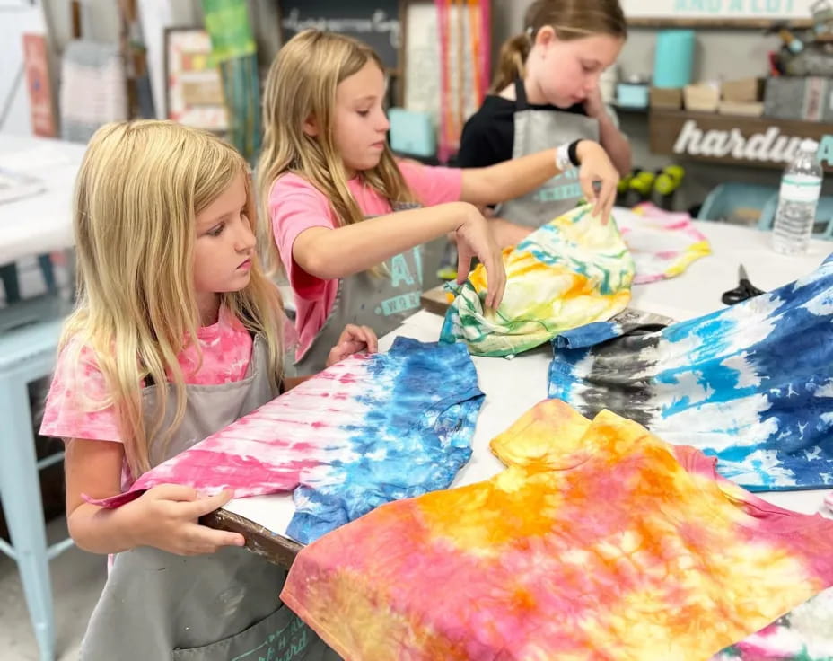 a group of girls painting