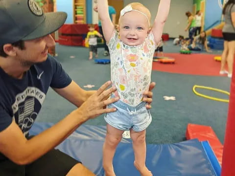 a person holding a baby