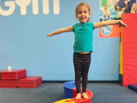 a girl standing on a toy