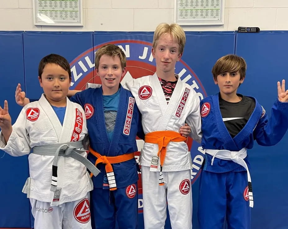 a group of boys in karate uniforms