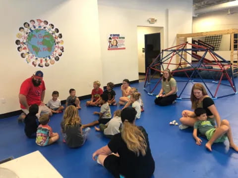 a group of people sitting on the floor