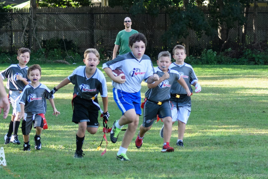 a group of kids playing a sport
