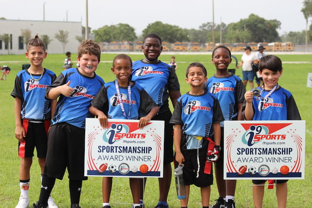 a group of boys holding signs