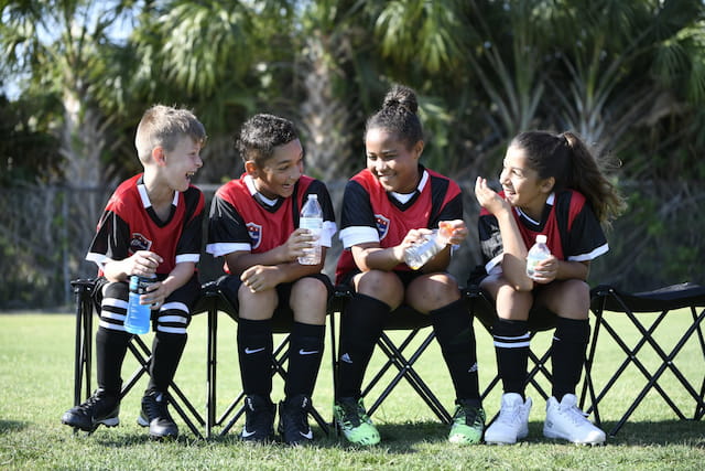 a group of people sitting on chairs