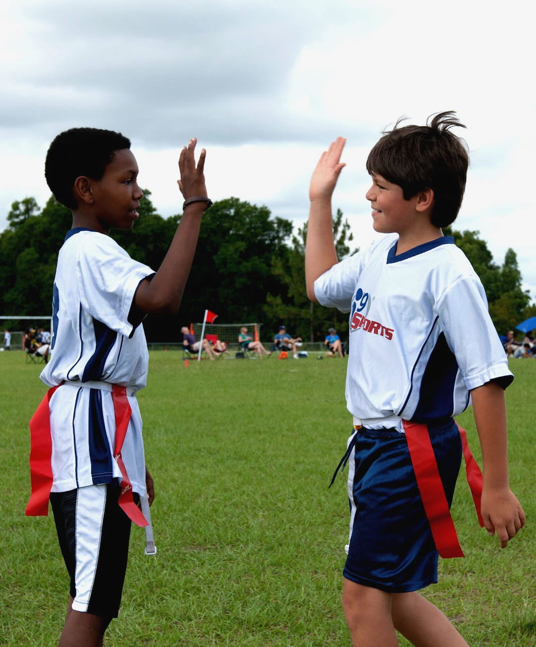 a couple of boys in sports uniforms