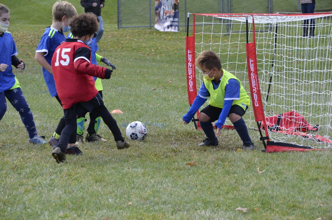 kids playing football on a field