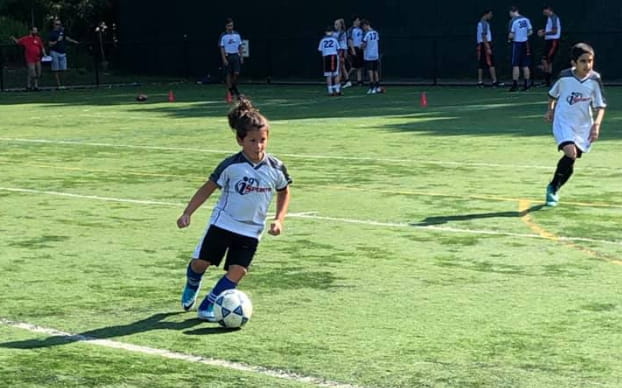 kids playing football on a field