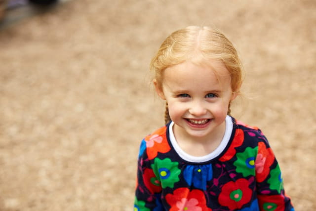 a child smiling for the camera