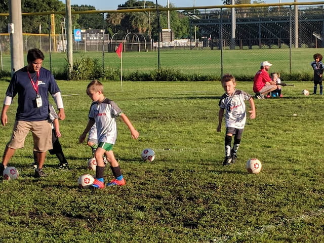 kids playing football on a field