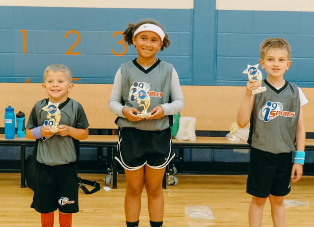 a group of kids holding small toys