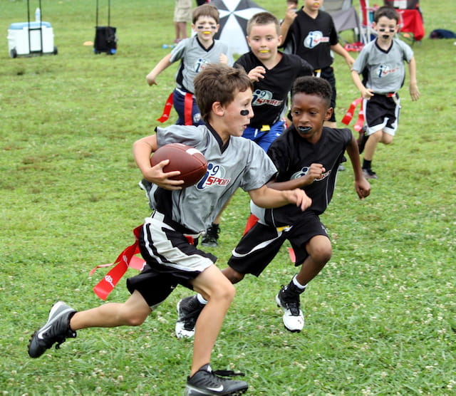 a group of boys playing football