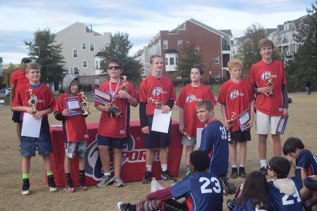 a group of people wearing red shirts