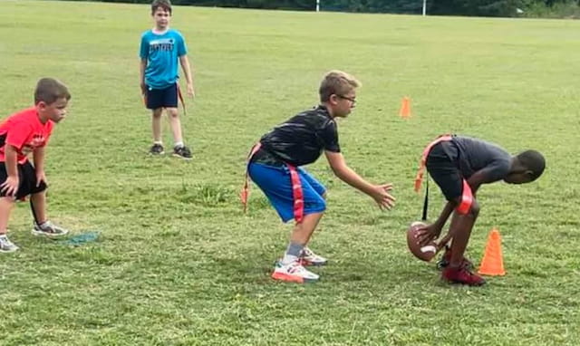 a group of boys playing football