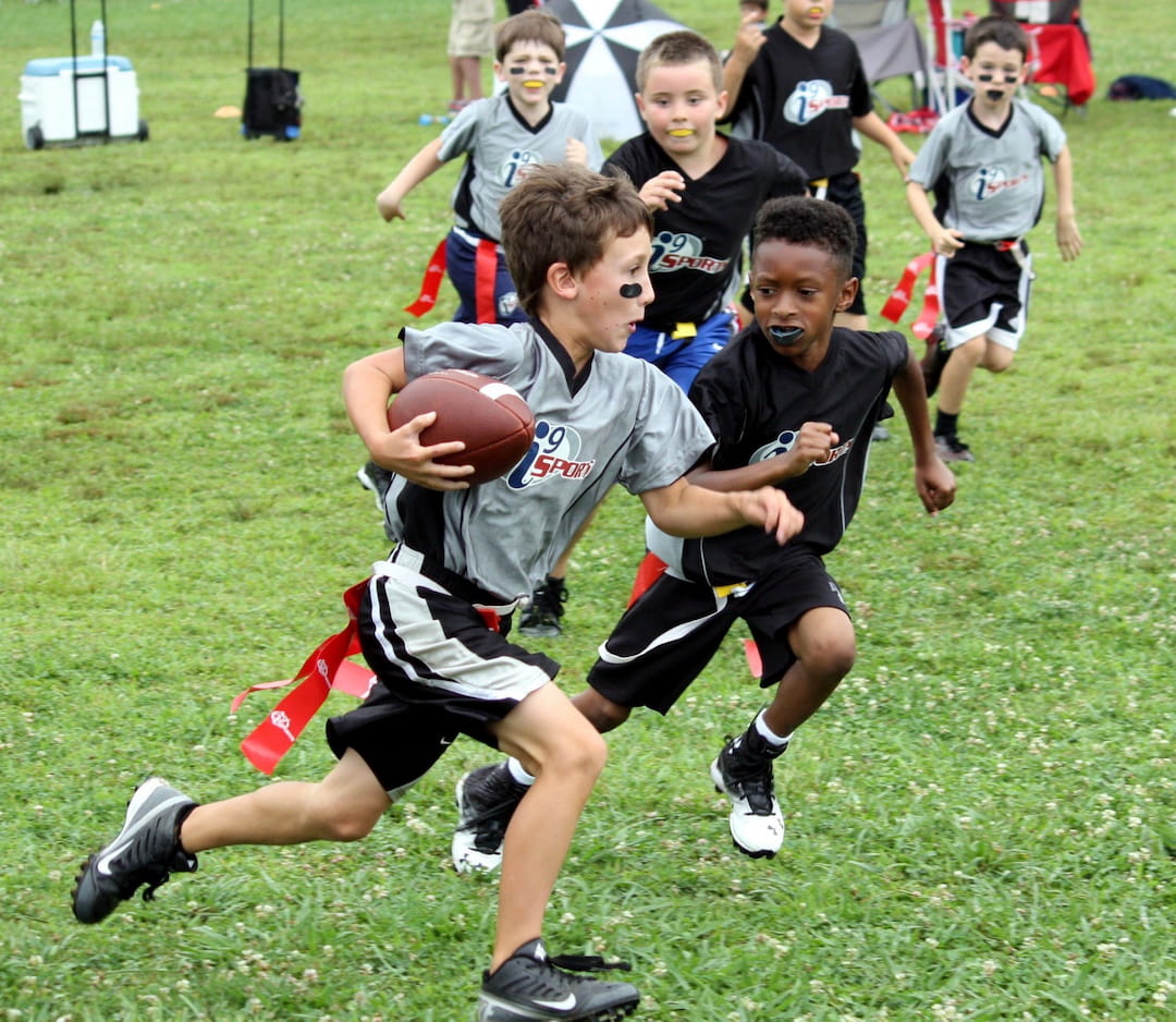 a group of boys playing football