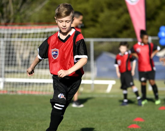 a boy running on a field