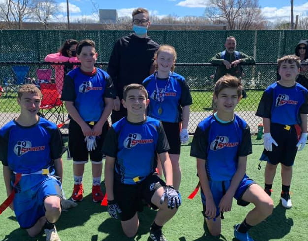 a group of kids in blue uniforms