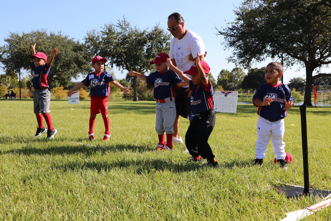 a group of kids playing in a field