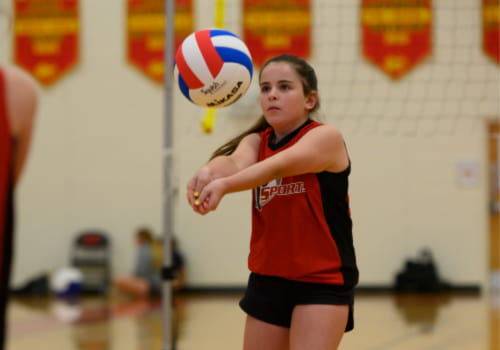 a woman playing volleyball