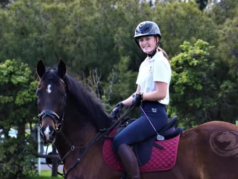 a girl riding a horse