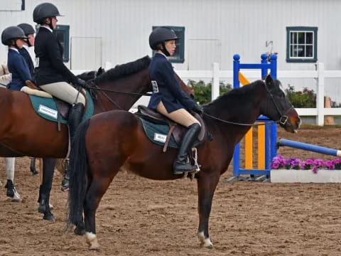 a group of people riding horses