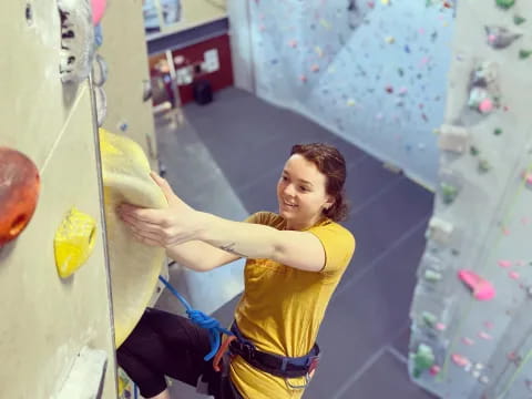 a man climbing a rock wall