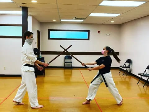 a couple of men in karate uniforms