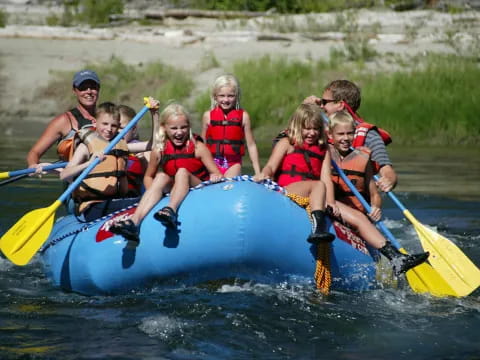 a group of people in a raft