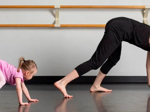 a man and a woman doing yoga