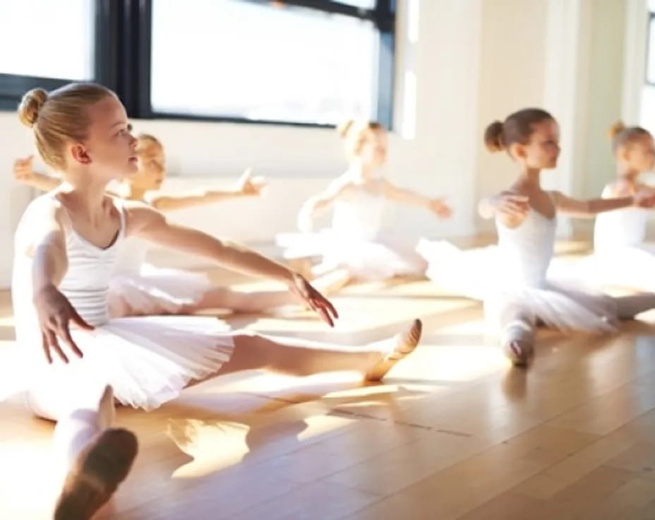 a group of children in white