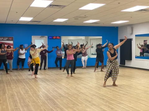 a group of people dancing in a room