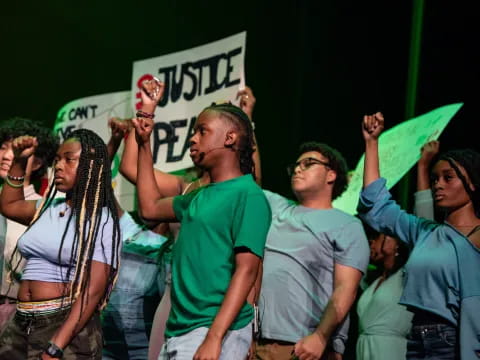 a group of people holding signs